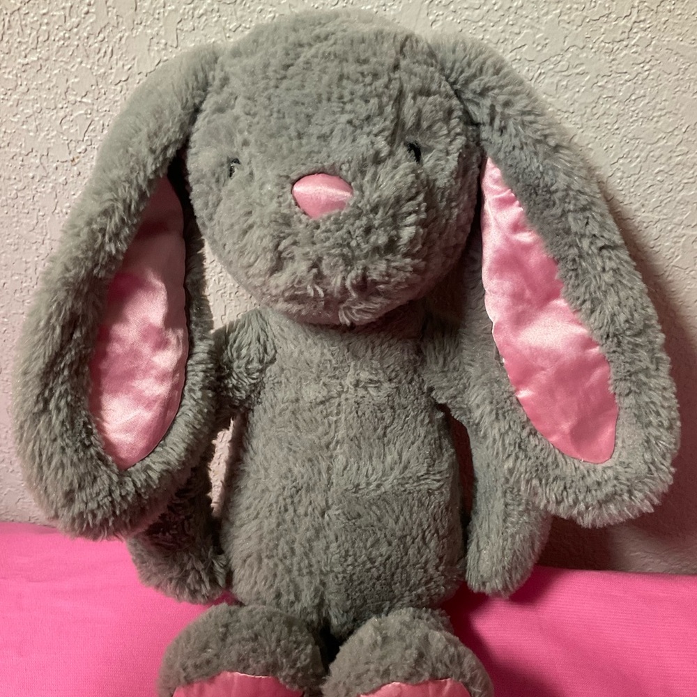 Fiesta Gray Plush Toy with Pink Background